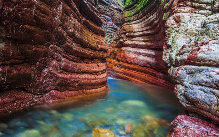 Colorful rock canyon with flowing water in Austria