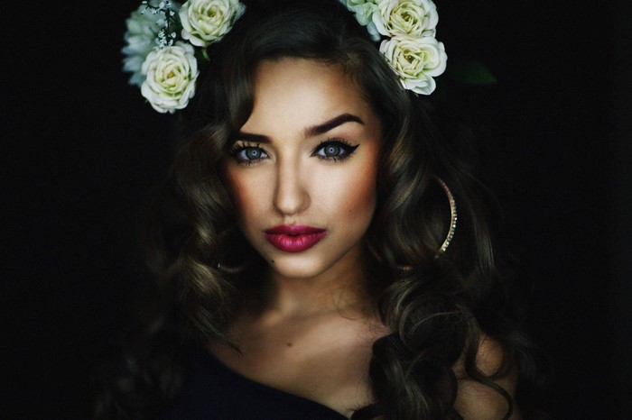 Woman with flower crown and hoop earring