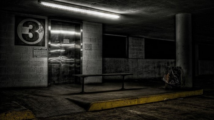 Parking garage level 3 elevator with bench
