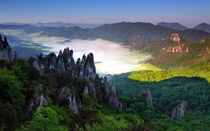 Rocky peaks and misty valley in a mountainous landscape