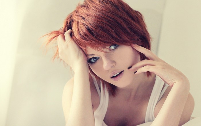 Redhead Woman with Short Hair and Blue Eyes