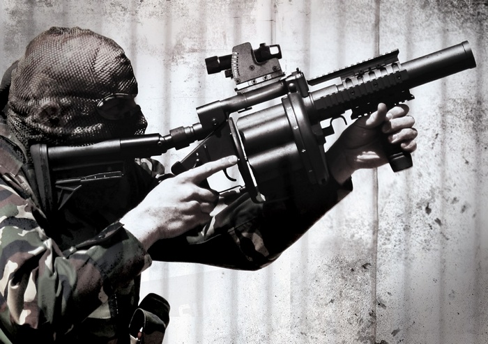 South African soldier with Milkor SuperSix MRGL grenade launcher