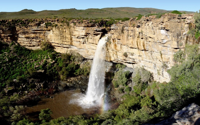 Waterfall cascading over a rocky cliff face