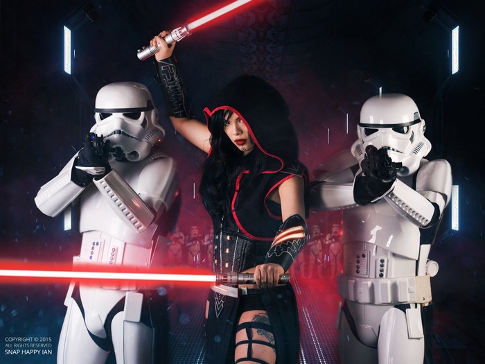 Sith Cosplayer with Stormtroopers and Lightsabers