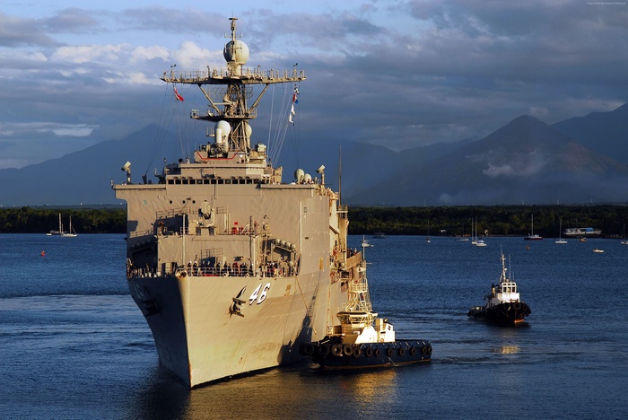 USS Tortuga (LSD-46) dock landing ship with tugboats
