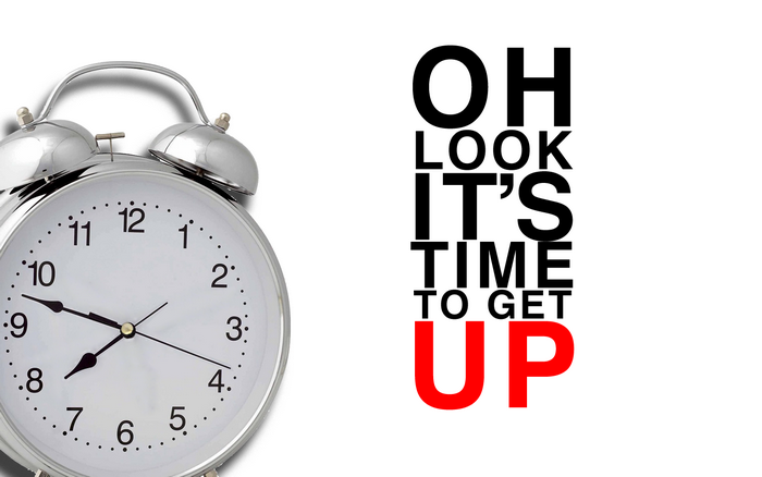 Alarm clock with "OH LOOK IT'S TIME TO GET UP" text