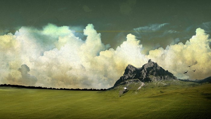Mountain landscape with clouds and birds