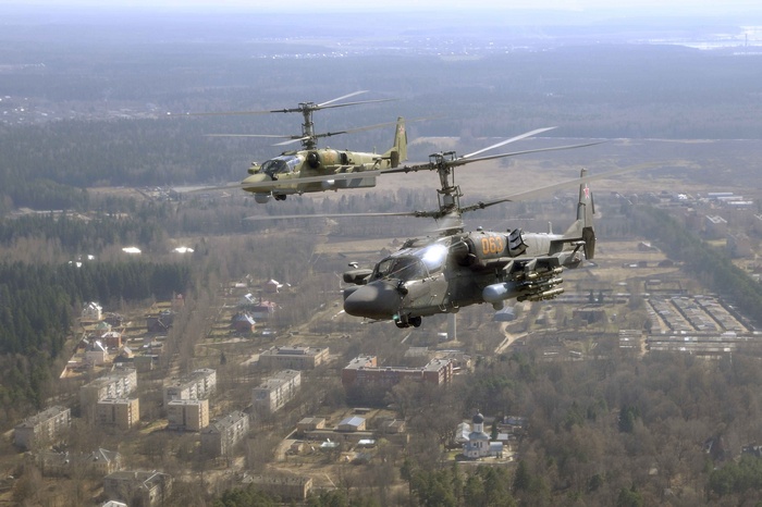Two Kamov Ka-50 attack helicopters in flight