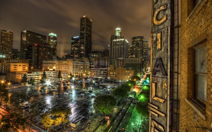 Nighttime cityscape of downtown Los Angeles with a parking lot