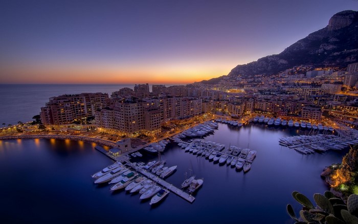 Monaco Marina at Dusk with Cityscape and Mountain