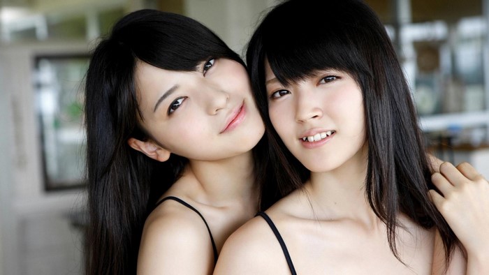 Portrait of Two Smiling Japanese Women with Black Hair