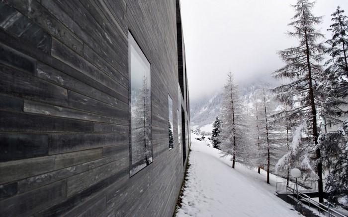 Modern building with windows in snowy mountains