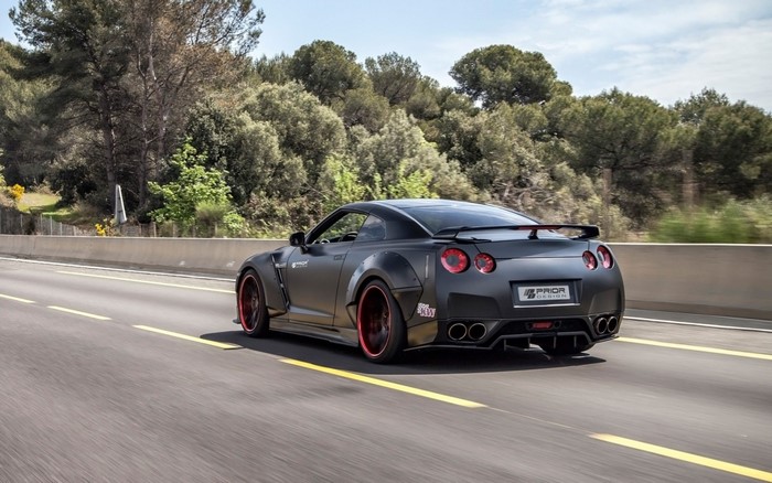 Matte black Nissan GT R PD750 Widebody on a highway