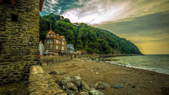 Coastal village with a funicular railway on a forested hill