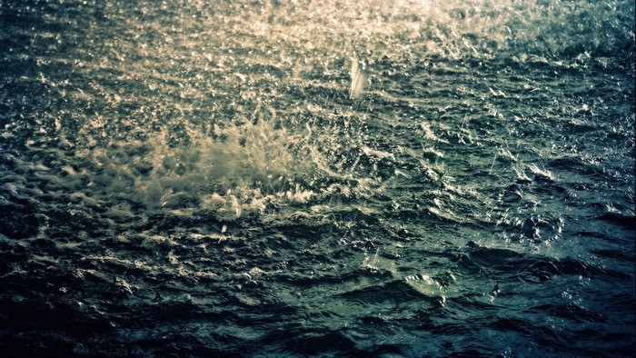 Rain falling on the ocean surface