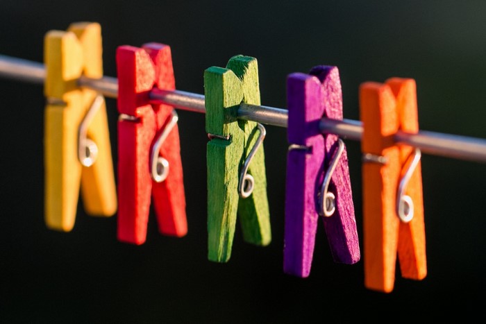 Colorful clothespins on a wire