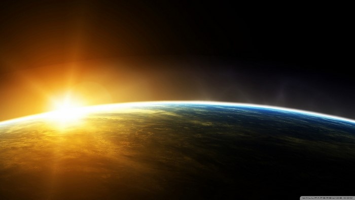 Sunrise over planet Earth from space