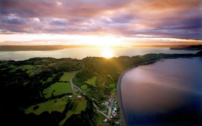 Aerial view of a coastal landscape at sunset