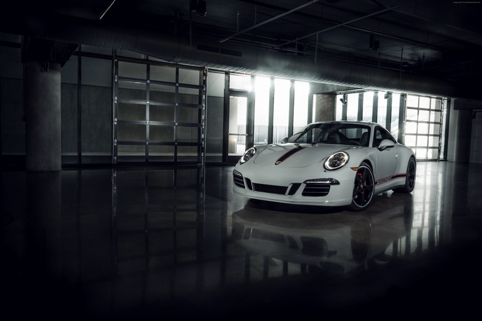White Porsche 911 Carrera GTS in a garage
