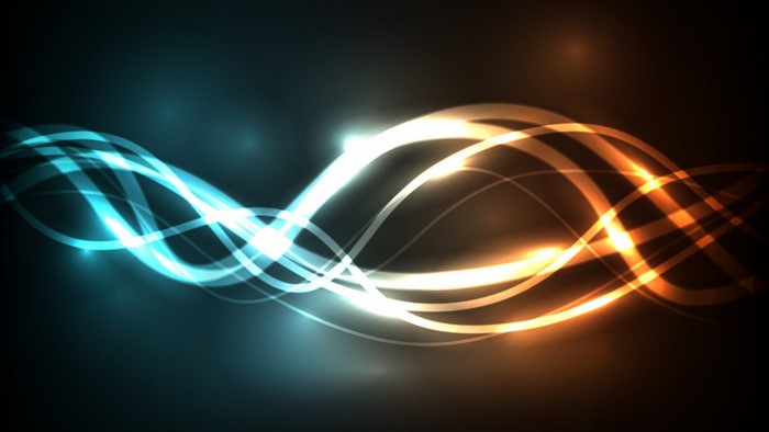 Abstract glowing light streaks in blue and orange