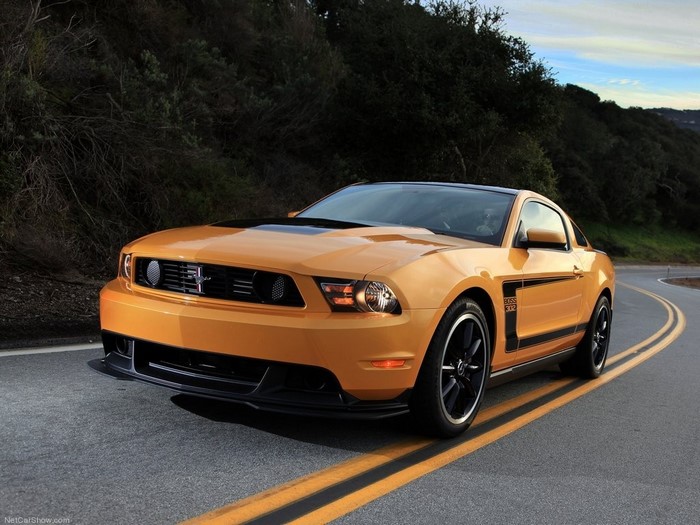 Orange Ford Mustang Boss 302 on a Winding Road