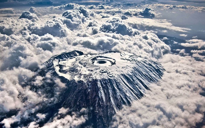 Mount Kilimanjaro summit crater surrounded by clouds