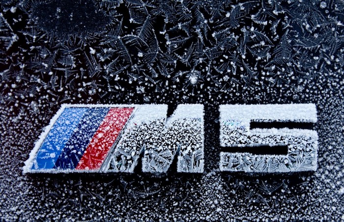 BMW M5 logo covered in frost