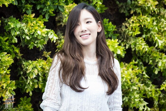 Kim Taeyeon from Girls Generation posing outdoors