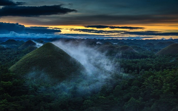 Chocolate Hills at sunrise with mist