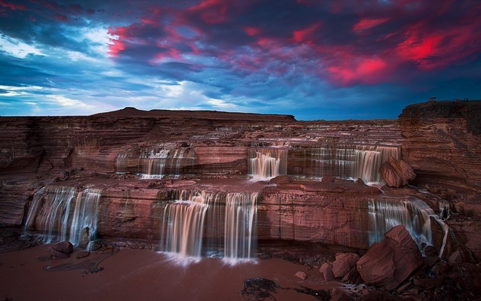 Grand Falls Arizona at sunset with red clouds