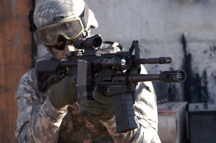Soldier aiming M26 Modular Accessory System shotgun