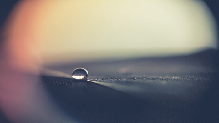 Macro photography of a water drop on a surface