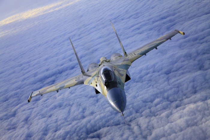 Russian SU-35 Attack Aircraft Flying Above Clouds