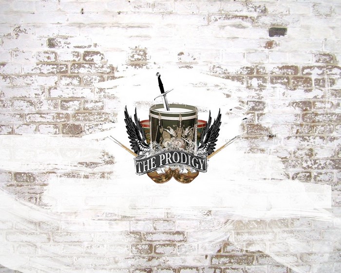 The Prodigy logo with drum and sword on brick wall