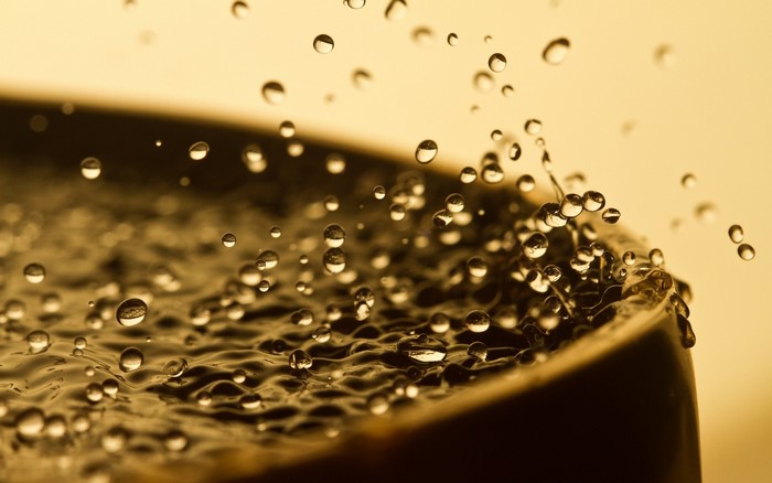 Macro photography of water drops splashing on a surface