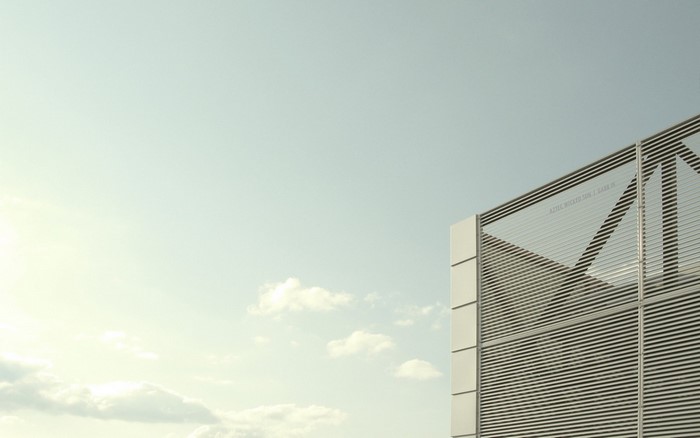 Modern Building Facade Against a Cloudy Sky