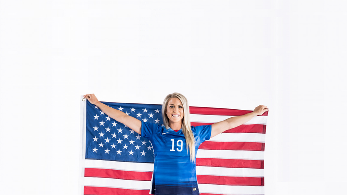 Woman in Soccer Jersey Holding American Flag