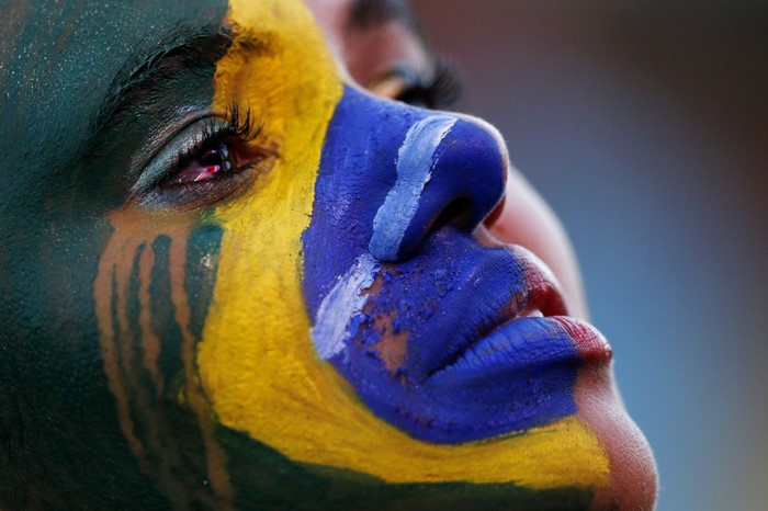 Close-up of a person with Brazilian flag face paint