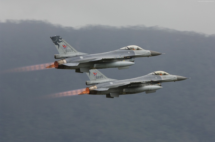 Two Lockheed Martin F-16 fighter jets in flight