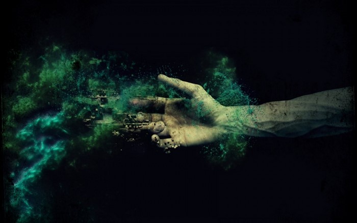 Digital art of a hand transforming into digital particles