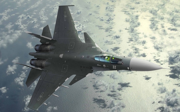 Shenyang J-15 fighter jet flying over clouds