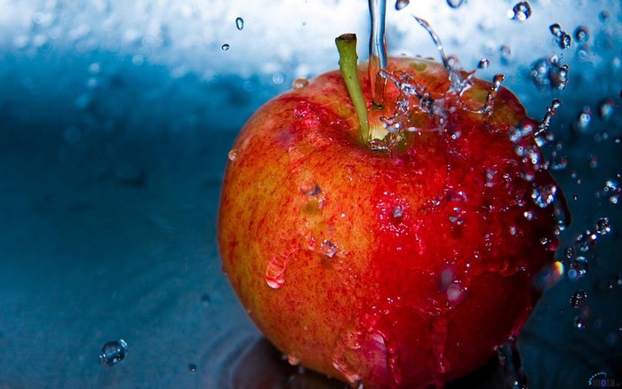 Red apple with water drops