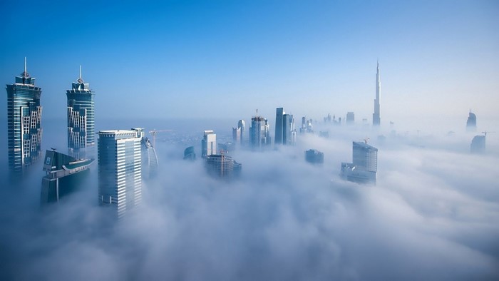 Dubai skyscrapers emerge from morning mist