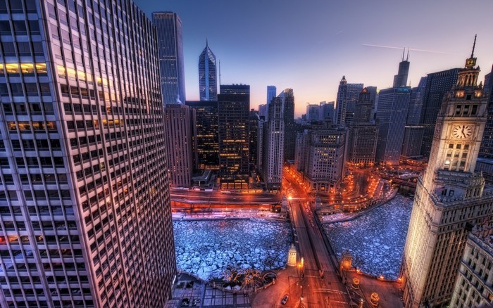 Chicago cityscape at dusk with frozen river and skyscrapers