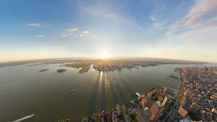 New York City skyline at sunrise over the water