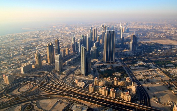 Aerial view of Dubai skyline with skyscrapers and highways