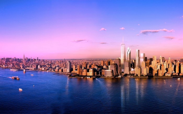 New York City skyline at sunset over the water