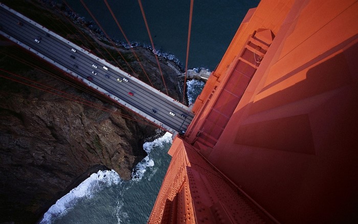Aerial view of Golden Gate Bridge traffic at dusk