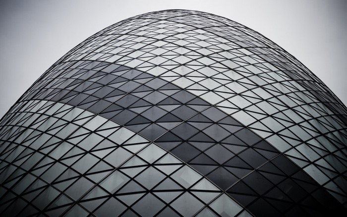 Monochrome facade of a modern skyscraper with geometric pattern