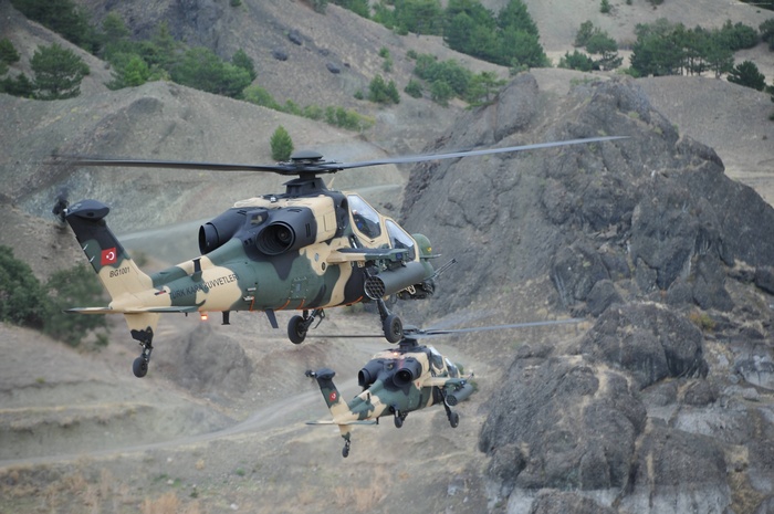 Two Turkish T-129 ATAK attack helicopters in flight